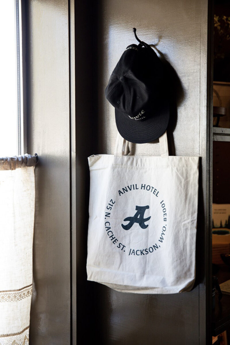 hat and bag hanging on wall