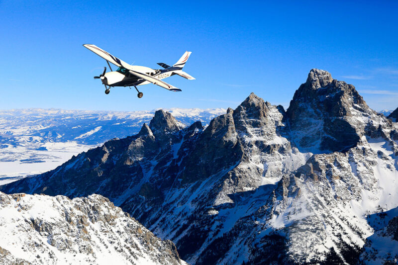 plane flying over mountains