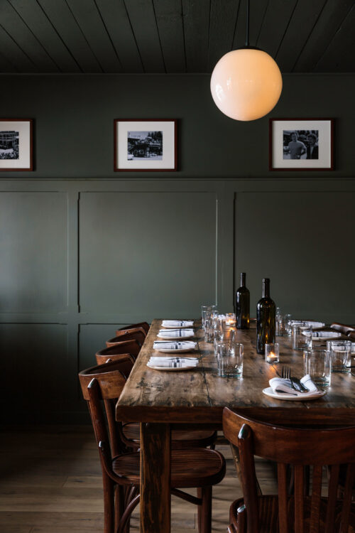 The private dining room at Glorietta Trattoria, with a formal table setting.