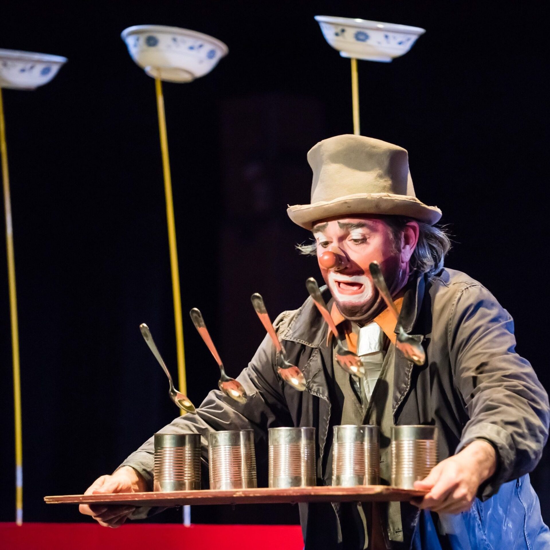 A clown performing on stage.
