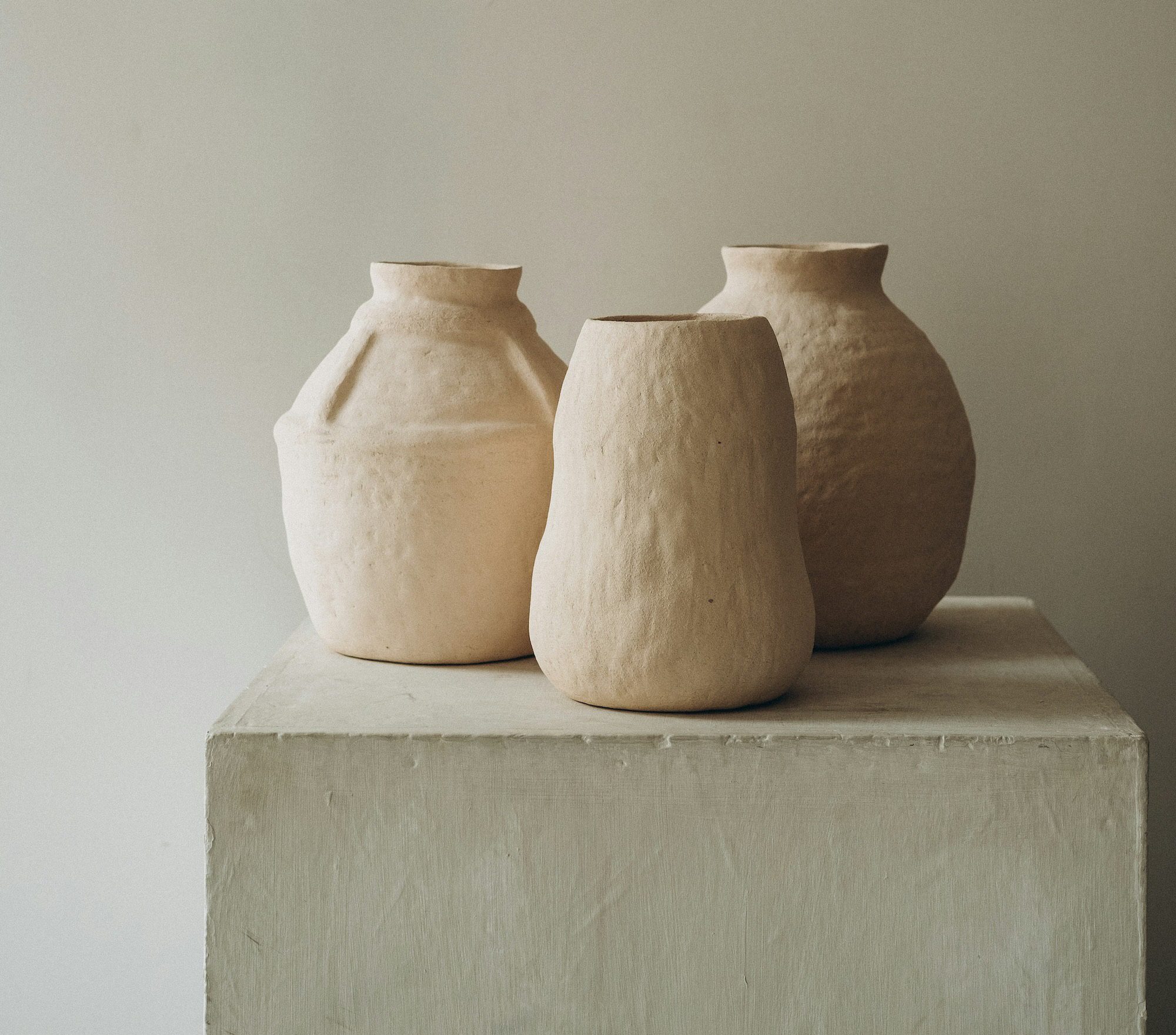 Ceramic pots on a pedestal.
