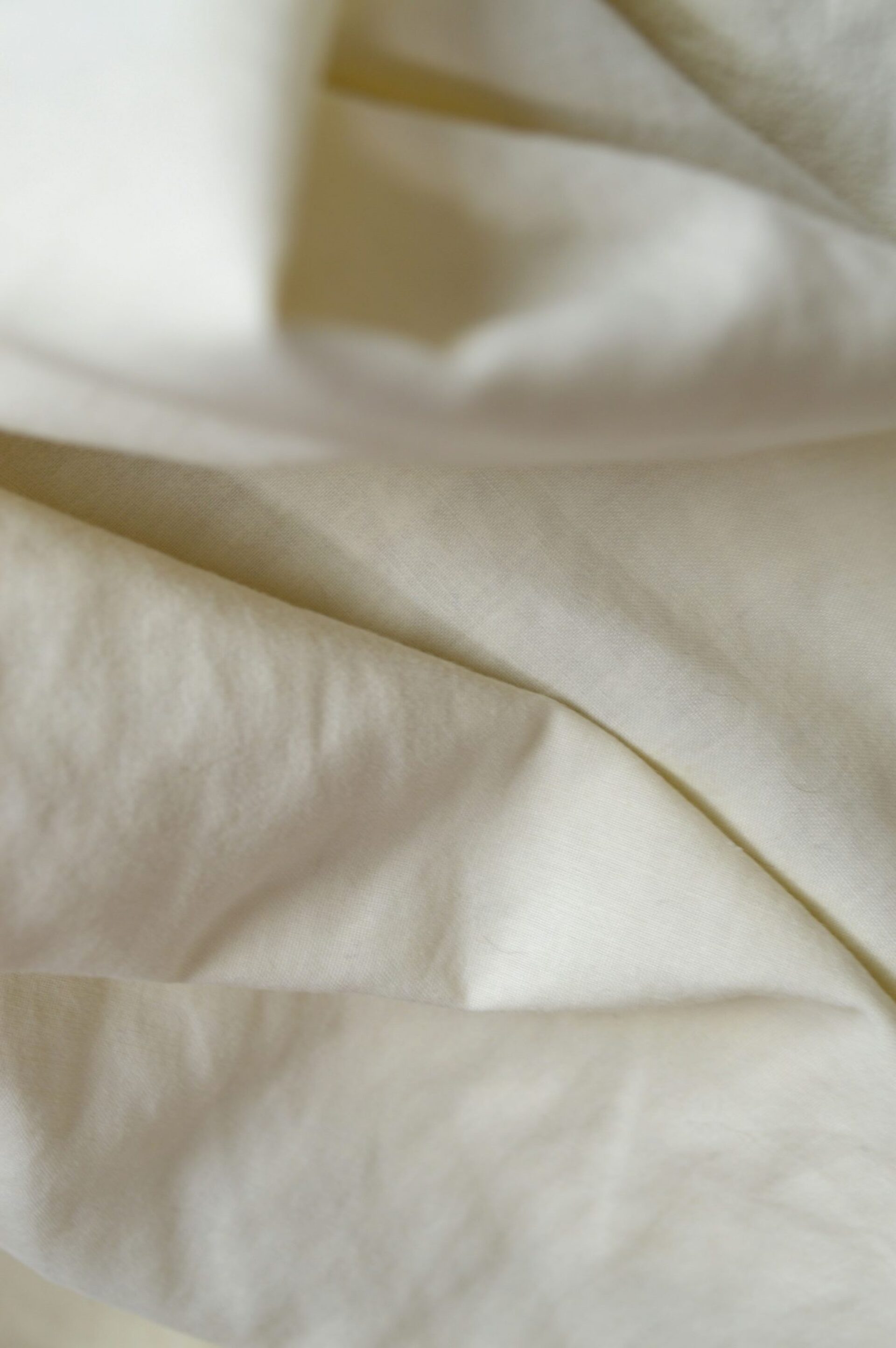 Folded white linen fabric.