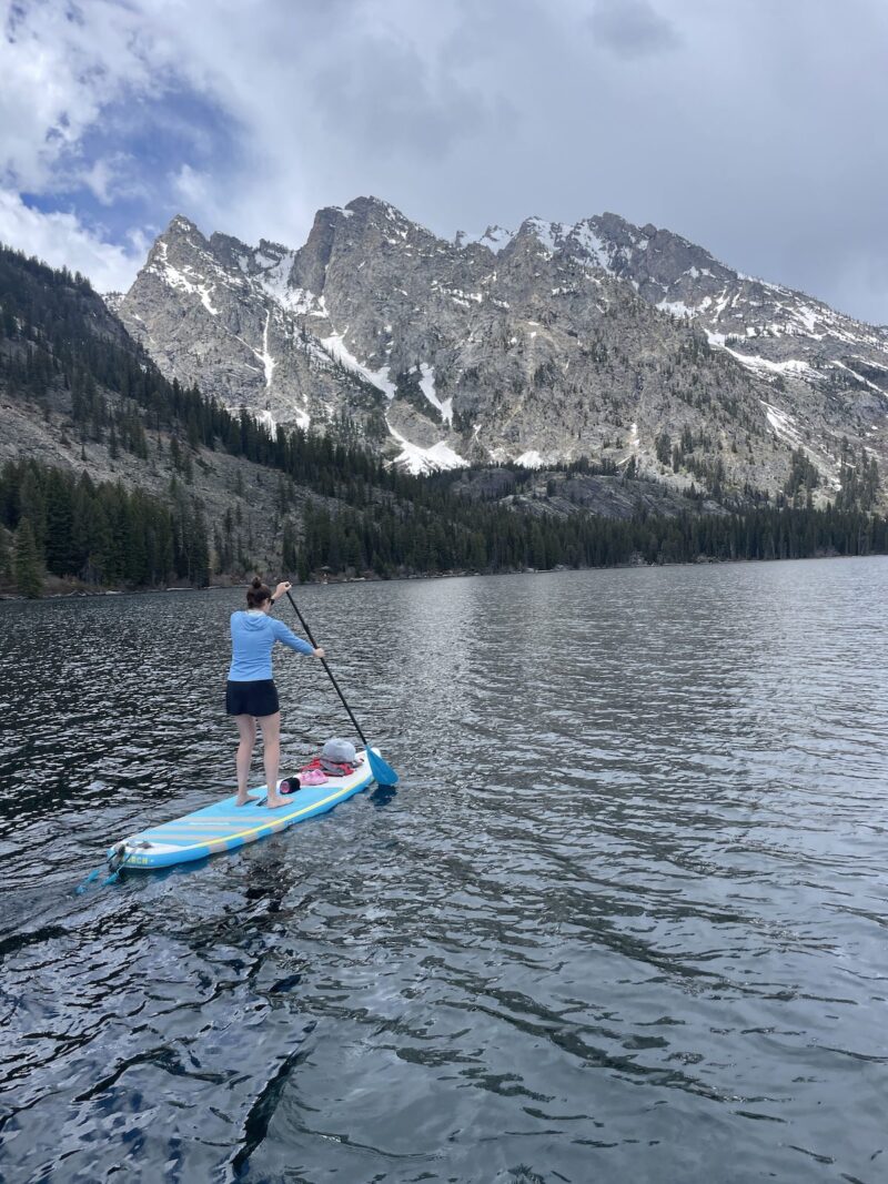 A woman paddle boarding in Jackson, Wyoming.