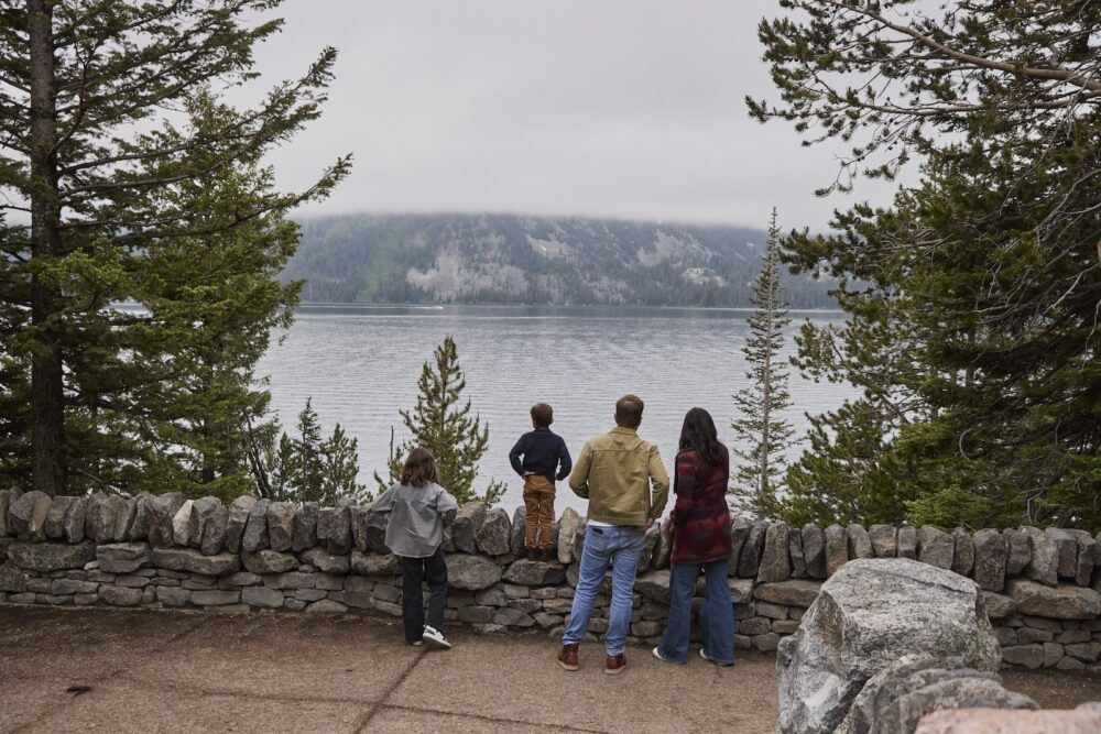 A family looking out at Grand Teton National Park.