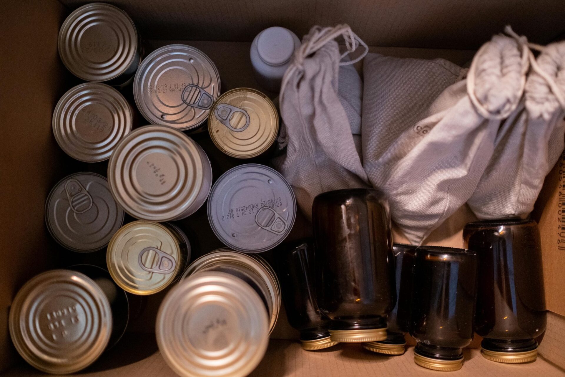 A box filled with canned goods.